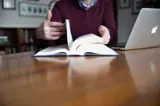 hands flipping through book 